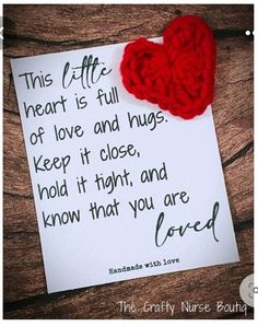 a piece of paper with a red heart on it next to a note that says, this coffee is full of love and hugs keep it close, hold it tight, and know that you are loved