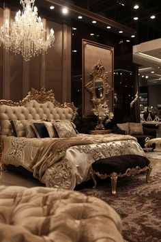 a luxurious bedroom with chandelier and bed