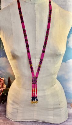 This stunning antique 1920s one of a kind authentic handmade woven beaded Sautoir necklace with tassels capped with red facet cut glass beads measuring in at a full 46 inches.  Woven using tiny glass seed beads in pink, navy blue, and topaz and accented with a blood red color glass seed beads with tassels capped with larger glass facet cut red beads.  The tassels create fun movement. The entire piece sparkles as all the beads are faceted. The perfect addition to any collection or jewelry wardrob 1920s Necklace, Blood Red Color, Necklace Art Deco, Flapper Necklace, Necklace Art, Art Nouveau Jewelry, Red Bead, Surprise Gifts, Unique Colors