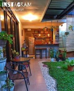 the inside of a house with lots of plants