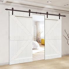 an open sliding door in a white room