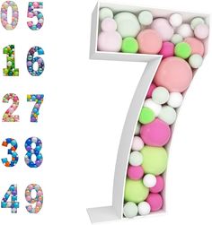 the number seven is made up of different colored balls and plastic candies in a white box