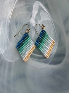 Dreaming of summer with these hand woven beaded earrings in beachy colors.  Earrings are light weight made with Japanese Miyuki Delica beads woven by hand attached to 14k gold plated earring hooks. Beachy Colors, Earrings Patterns, Miyuki Delica Beads, Beachy Vibes, Beach Earrings, Delica Beads, Earring Hooks, Gold Plated Earrings, Vacation Ideas