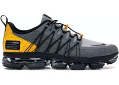 the nike air vapor flyknit 2 is shown in grey, yellow and black