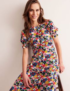 Corinne Midi Tea Dress - Multi, Paintbox Ditsy. Corinne Midi Tea Dress.Multi, Paintbox Ditsy.Smocked cuffs and a figure-skimming bias-cut give the Corinne midi dress a point of difference. Show it off from AM to PM. Am To Pm, Boden Uk, Tea Dress, Shirts & Tops, Green Dress, Athleisure, Dress Black, Smocking, Black Dress