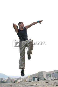 a man jumping in the air with his arms outstretched