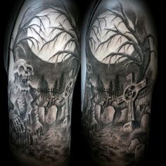 a man's arm with an image of a skeleton and graveyard scene on it