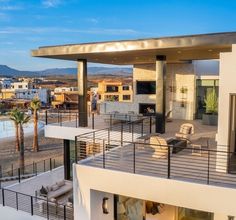 an aerial view of a modern home overlooking the beach