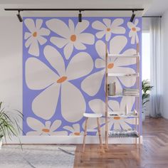 a white and blue flower wall mural in an empty room