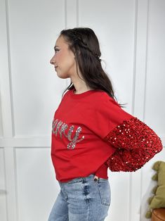 Feeling merry and bright this holiday season?! Then The Be Merry Top from White Birch is for you! It features long embellished sequin sleeves, round neckline, straight hemline, "Merry" across the front in sequin embellishments and a oversized loose fit. The fabric is thicker than your typical tee shirt material and a little more lightweight than your typical sweatshirt. Pair with our "Grounded Warrior Leggings" for something more casual and laid back or pair with our "Lovervet Take Me Higher Hig Warrior Leggings, Denim Jacket Short, Sequin Sleeve, Be Merry, White Birch, Denim Joggers, Graphic Tops, Boot Cut Denim, Tall Girl