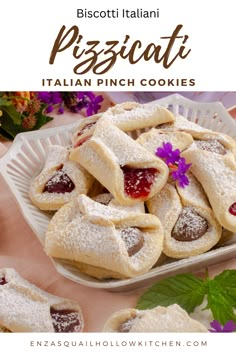 small pizzas with powdered sugar and jelly on them in a white dish surrounded by flowers