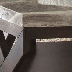 a close up of a table with a white and black marble top on the bottom