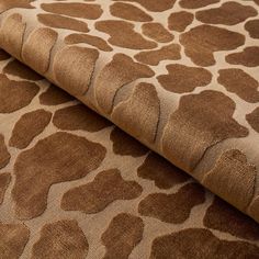 an animal print fabric with brown spots