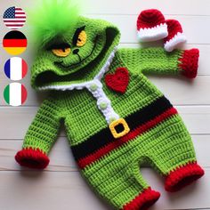 a crocheted green and red baby's outfit next to an american flag