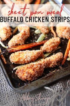 fried carrots and other vegetables on a baking sheet with tongs in them, ready to be eaten