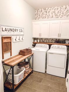 a laundry room with washer and dryer in it