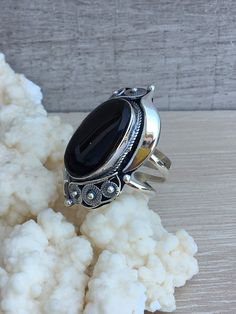 Silver ring with black onyx stone for women in technique filigree. Filigree work is very popular and never goes out of fashion. The black stone onyx gives this ring much more effectivity and uniqueness. If you are looking for something original, unique, and modern, you are in the right place! Our designer, owner, and jewelry maker Vartan Shahinian, who is also an Armenian FOLK art master, care you get the best quality, beautiful and unique work. Don`t forget to favorite our Etsy shop to get ever Black Oval Filigree Jewelry, Elegant Black Sterling Silver Engraved Ring, Oval Black Filigree Jewelry, Elegant Black Engraved Sterling Silver Ring, Black Filigree Ring Jewelry, Black Ring With Intricate Design, Black Oval Filigree Ring, Black Filigree Ring, Silver Onyx Cabochon Rings