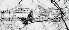 a black and white photo with butterflies on music notes in the background, surrounded by branches