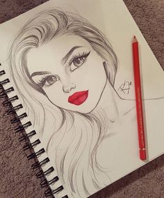 a pencil drawing of a woman's face with red lipstick and long wavy hair