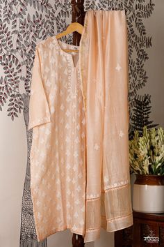 Regal Peach coloured Boteh (boota) Kurta Dupatta set with running floral motif on the front body. The back has small floral bootis to give an overall neat look to the ensemble. A Chanderi dupatta matches the floral bootis on the body the kurta back. Lace detailing adds to the beauty of the ensemble. Stitching of the Kurta is complimentary by Meiraas, along with cotton detachable slip. We have just 1 piece in this ensemble that can be made from S - XXL, so leave your size in the Customer Note, as per our size chart given. The Sustainability Quotient (SQ): 1. Skilled Resham Hand Embroidery 2. Antique hand carved wooden hand block motif printing, following all processes 3. Handloom Chanderi fabric ARTISANAL CHIKANKARI BY MEIRAAS KHAYAL (moodboard): Boteh or Boota is the backbone of the crafts Luxury Bohemian Dupatta With Chikankari Embroidery, Festive Semi-stitched Cutwork Kurta, Sharara With Chikankari Embroidery And Straight Kurta In Chanderi, Raw Silk Lawn Suit With Chikankari Embroidery, Transitional Chikankari Embroidery Churidar In Raw Silk, Chikankari Embroidery Raw Silk Lawn Suit For Designer Wear, Designer Raw Silk Lawn Suit With Chikankari Embroidery, Festive Raw Silk Lawn Suit With Chikankari Embroidery, Transitional Churidar With Chikankari Embroidery In Raw Silk