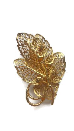 Beautiful Judy Lee filigree leaf brooch in gold signed Judy Lee in block in a circle on the back. This is a large pin. Pin measures 3 1/2 inches by 2 1/2 inches. Excellent condition pin works great and there are no signs of wear. Vintage jewelry will ship in a gift box. I included some information on Judy Lee below. To view our vintage brooch section click here: https://www.etsy.com/your/shops/WhyWeLoveThePast/sections/14306578 Click on the link below to view our shop page and available COUPON D Gold Leaf Brooch For Gift, Gold Brooches With Intricate Design For Anniversary, Filigree Jewelry, Pin Pin, Gold Sign, Leaf Brooch, Art Deco Earrings, Vintage Brooch, Art Deco Ring