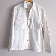 White Jean Button Down Top. Definitely A Trending Piece, New With Tags. Always Accepting Reasonable Offers And Sending Additional Discounts On Bundles! I Am No Longer Taking Measurements, Those Comments Will Be Respectfully Ignored. Happy To Answer All Other Questions! Casual White Shirt With Lapel Collar, White Button Closure Shirt For Fall, Casual Collar Linen Shirt With Buttons, Unstructured Collared Tops With Buttons, Unstructured Top With Buttons And Lapel Collar, Everyday Shirt With Button Closure And Camp Collar, Everyday Shirt With Button Closure And Lapel Collar, Everyday Shirt With Button Closure, White Button-up Tops With Buttons