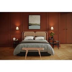 a bedroom with red walls and wooden floors