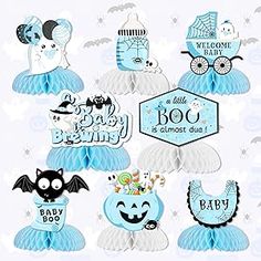 blue and white baby shower decorations with bats, pumpkins, diaper cake toppers