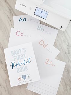 four baby's first alphabet books are on the table