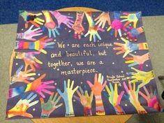 a group of children's handprints on a purple background with the words we are each unique and beautiful but together, we are a masterpiece