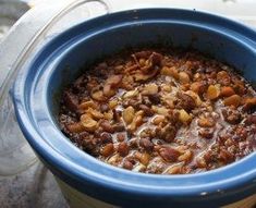 a blue pot filled with food sitting on top of a table