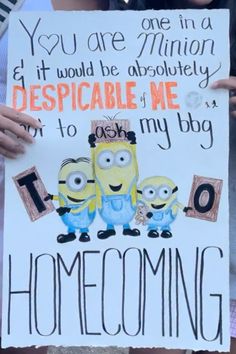 two people holding up a sign that says, you are minions and if would be absolutely despicable me to my baby