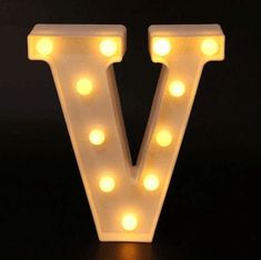 the light up letter v is on display