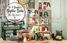 there are many dolls on display in this room