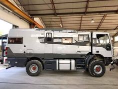 an off road vehicle parked in a garage