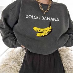 Dolce & Banana Sweatshirt: Funny Graphic Oversized Pullover for Women | Comfy Casual Fall Fashion Get cozy in style with this hilarious Dolce & Banana sweatshirt! Featuring a playful banana graphic and a cheeky twist on a famous brand, this oversized sweatshirt is perfect for adding a touch of humor to your casual outfits. Whether you're lounging at home or stepping out for a casual day, this soft and comfy pullover will keep you warm and stylish. Made from high-quality fabric, this graphic swea Oversized Sweat Shirt, Graphic Sweatshirt Outfit, Xmas Party Dresses, Belted Wrap Dress, Christmas Dress Women, Banana Print, Pull Oversize, Women Sweatshirts, Grunge Streetwear