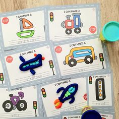 four pictures of cars and traffic lights on the table with scissors, markers, and other toys