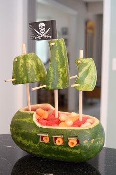 a watermelon boat made to look like a pirate ship