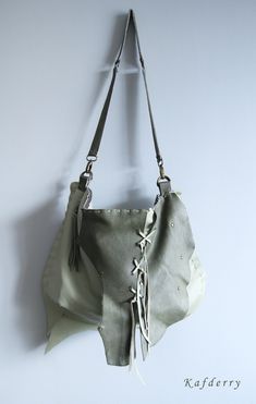 This bohemian bag is made of genuine  leather in light and dark olive green tones. I use fringe details.  There are 2 pockets inside and one of them is zippered. All sewings are handmade  carefully.  Its  width is 44 and height is 32 cm. Thickness is 8 cm. (17'' x12,5'' x 3'' ) Please note that color may vary according to monitor color calibrations. If you have any question, please don't hesitate me to ask whatever you want know. Green Bohemian Bags With Leather Handles, Bohemian Green Shoulder Bag For Everyday, Bohemian Fringe Hobo Bag For Daily Use, Leather Bohemian Hobo Bag, Bohemian Leather Hobo Tote Bag, Bohemian Green Bucket Bag For Daily Use, Everyday Tassels Crossbody Shoulder Bag, Green Bohemian Shoulder Bucket Bag, Green Fringe Shoulder Bag For Everyday Use