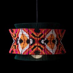 a colorful light hanging from a ceiling fixture