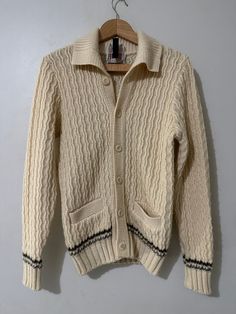 Vintage Cardigan Sweater  - Rare  - Banff tagged  - Made in Canada  - Cable knit  - Varsity striped  - Pocketed  - Button up  Size: Large  Good vintage condition No rips or holes  No stains White Cable Knit Button-up Outerwear, Fitted Beige Cardigan With Ribbed Cuffs, Casual Striped Sweater With Button Closure, Striped Button-up Fall Sweater, Striped Button-up Sweater For Fall, Fall Striped Button-up Sweater, Striped Long Sleeve Cardigan With Buttons, Striped Long Sleeve Sweater With Button Closure, Cozy Fitted Sweater With Button Closure