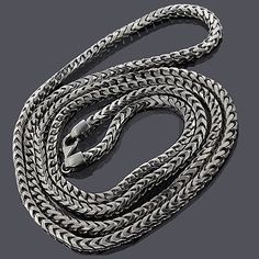 This Sterling Silver Franco Chain Necklace (3.5mm wide) with a Black Rhodium plating for a trendy look is a squared off chain and weaved together for a luxurious look. It takes the top of the line craftsman to make this silver chain, where each individual facet is welded in a perfect fit for excellent movement and flexibility. This solid Italy made 925 sterling silver Franco chain will not kink and you can even roll it around your finger! It is a polished type chain, yet it catches the light wit Black Nickel-free Chain Necklace, Sterling Silver Gunmetal Chain Necklace, Silver Oxidized Chain Link Necklace, Silver Stainless Steel Rope Chain Necklace, Mens Silver Chain Necklace Jewelry1000.com, Black Rhodium, Rhodium Plated, Silver Chain, Sterling Silver Rings