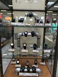 a display case filled with lots of different types of watches