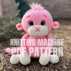 a pink knitted monkey sitting on top of dry grass with the words knitting machine pattern below it