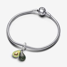 Two halves make a whole, just like pandora's hand-painted avocado charm with realistic details. Three different shades of green enamel create depth and texture and a 14k gold-plated seed fits perfectly into the hollow other half. Add it to your collection as a symbol of the one who completes you or simply to express your love for avocados. Sterling silver and 14k Gold-plated unique metal blend Depth: 8 mm Height: 11.8 mm Width: 8.5 mm The Hollow, Different Shades Of Green, Other Half, True Red, Green Enamel, Dangle Charms, Shades Of Green, Persona, Avocado