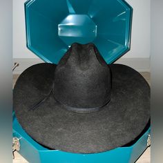 Schneiders Cowboy Hat Showman Western 7 1/8 Long Oval. Black. And Hat Carrier Is Included. Black Flat Crown Fedora For Kentucky Derby, Vintage Black Hat With Flat Crown, Classic Black Felt Hat For Rodeo, Black Top Hat For Kentucky Derby With Flat Crown, Black Brimmed Felt Hat For Western-themed Events, Black Brimmed Felt Hat For Country Events, Classic Black Hat Bands For Ranch, Western Black Brimmed Felt Hat, Black Short Brim Felt Hat For Ranch