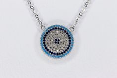 Sterling silver evil eye blue and white cubic zirconia necklace. 17 inch length +1 inch extender total of 18 inch necklace The evil eye is a talisman that is meant to protect you from these evil spirits. The evil eye is a 'look' or 'stare' believed to bring bad luck for the person at whom it is directed. A modern piece of everyday appearance but also it is a unique gift for your special ones. (bridesmaid gift, birthday gift, ) as protection from bad eyes.  Stones: Blue and White  Cubic Zirconia Evil Eye Cubic Zirconia Round Necklaces, Evil Eye Round Cubic Zirconia Necklace, Blue Evil Eye Necklace, Evil Eye Blue, Zirconia Necklace, Heirlooms Jewelry, Cubic Zirconia Necklace, Bad Luck, Blue Evil Eye