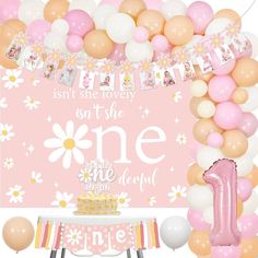 a pink and white 1st birthday party with balloons, flowers, and an one - the - first sign