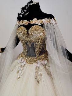 a wedding dress is displayed on a mannequin with veils and flower decorations