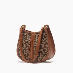 Upgrade Your Style with the Leopard Saddle Shoulder Bag Elevate your fashion game with our Leopard Saddle Shoulder Bag, crafted from premium microfiber leather for a luxurious feel. Designed for the modern woman, this bag combines functionality with trend-setting style, making it the perfect accessory for any occasion. Product Features Microfiber leather upper for durability and a sleek look Polyester lining material for added strength and resilience Zipper closure for secure storage of your essentials Bow decoration adds a touch of charm and femininity Spacious interior with an interior slot pocket for easy organization Available in classic Black or versatile Brown Benefits You'll Love Elevated Style: Stand out from the crowd with the chic leopard print design and sleek saddle shape of th Trendy Faux Leather Bag For On-the-go, Luxury Coated Canvas Saddle Shoulder Bag, Trendy Top Handle Shoulder Bag For On-the-go, Trendy On-the-go Bag With Detachable Handle, Large Capacity Saddle Bag For Shopping, Handheld Baguette Bag With Adjustable Strap For On-the-go, Shopping Crossbody Baguette Bag, Modern Leather Baguette Bag For On-the-go, Luxury Baguette Bag With Leather Handles For Everyday Use